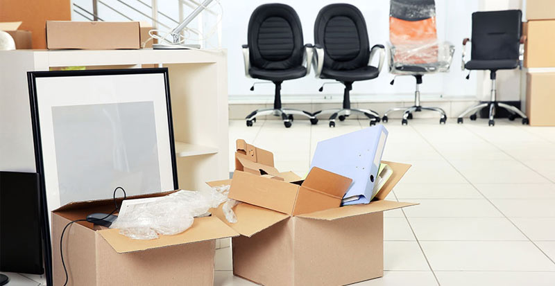 Couple moving with boxes